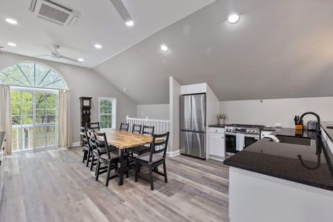 Gather around the elegant dining table for memorable family meals.