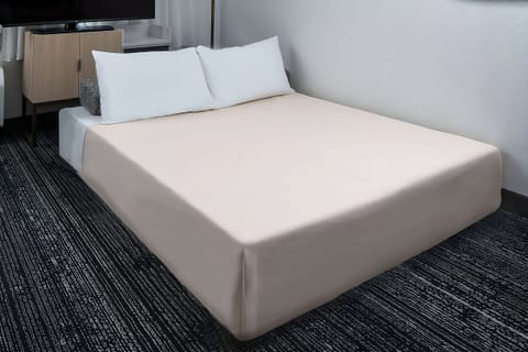Sink into a plush king bed for deep, quiet rest