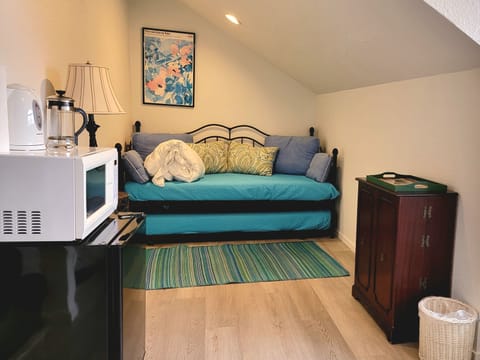 No kitchen/utensils. We provide microwave, electric kettle, 4 mugs, & coffee.