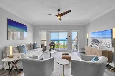 Sleek beach condo living room: modern furnishings, stunning ocean vista. Coastal chic at its finest. #RelaxationMode