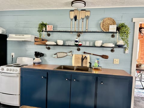 This stove has been replaced with a modern glass top stove.