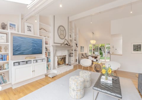 Living Room with Wood Fireplace and Smart TV