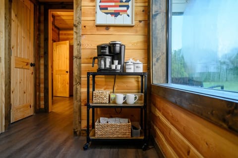 Coffee Station - Your Morning Brew Awaits Start your day right with a fully stocked coffee station, featuring a coffee maker, mugs, and everything you need to enjoy a fresh cup of coffee while taking in the beautiful surroundings.
