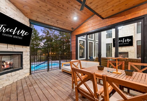 The spacious covered patio is the ideal spot to enjoy meals and conversations while being surrounded by nature.