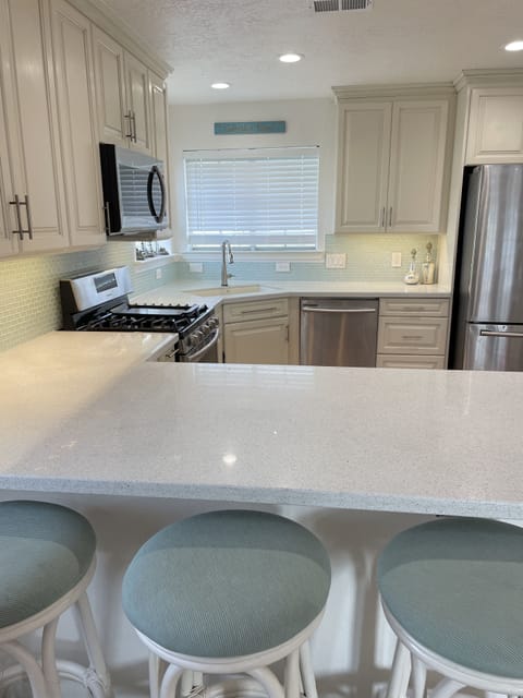 Kitchen to the right of the Dining Room