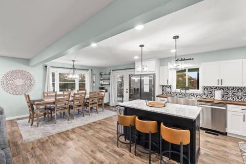 Spacious kitchen with large island, new appliances, scenic view, ideal for cooking / entertaining.