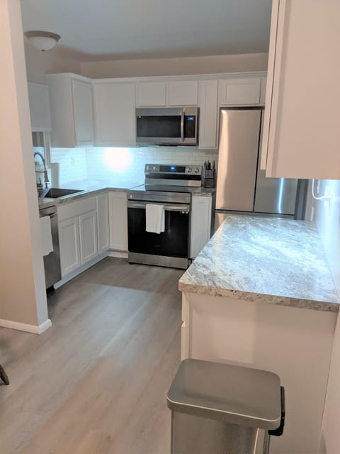 Kitchen Area with stainless appliances.