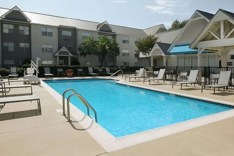Soak up the sun beside the sparkling outdoor pool and loungers.