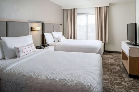 Unwind in bright double beds for restful nights together.