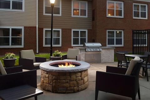 Gather by the glowing firepit for cozy evening conversations.