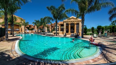 Dive in and lounge beneath palms on warm afternoons.
