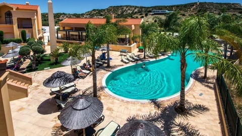 Soak up sunshine with panoramic views over the sparkling pool.