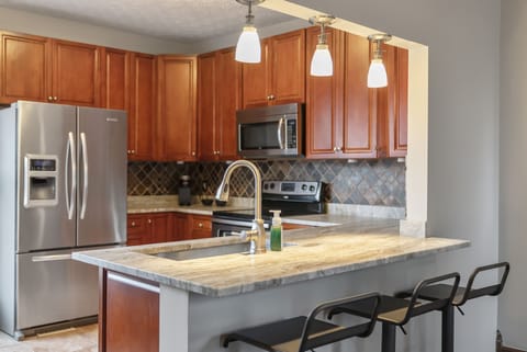 Upstairs kitchen and bar area - seating for 7.