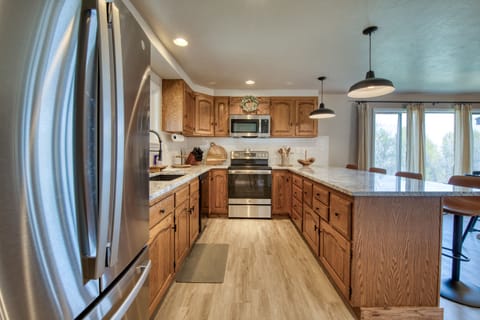 Beautiful kitchen with warm wood cabinets and granite countertops
