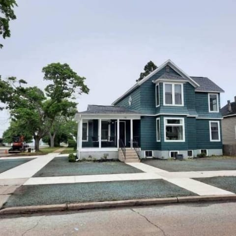 Front of home recently painted and newly landscaped