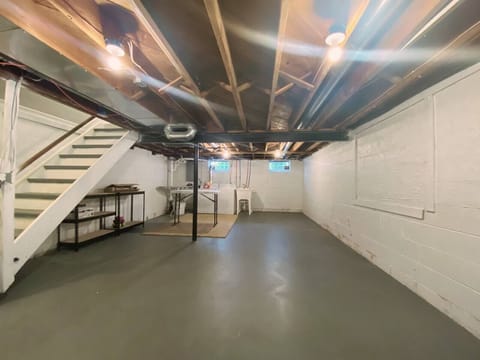 Huge basement with full washer and dryer and table to iron and fold.