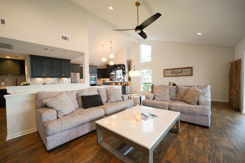 Living room looking into kitchen and dining area.
