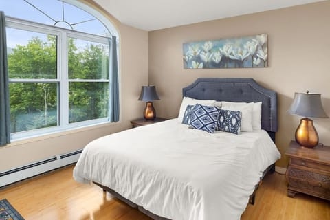 Queen bedroom with shared bathroom.