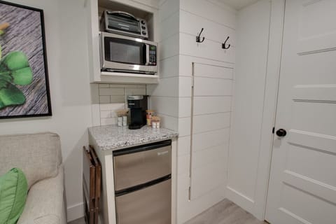 Cozy tiny cottage kitchenette stocked with essentials | prepare meals with ease, from morning coffee to dinner, perfect for couples or solo travelers seeking a relaxing nature escape