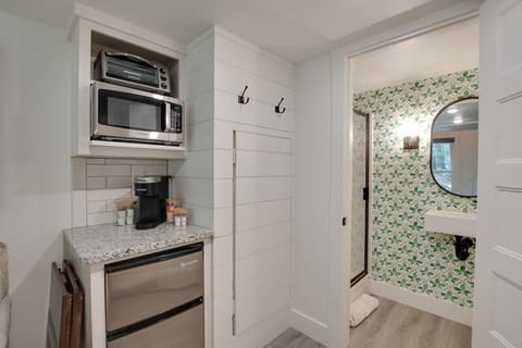 Cozy tiny cottage kitchenette stocked with essentials | prepare meals with ease, from morning coffee to dinner, perfect for couples or solo travelers seeking a relaxing nature escape