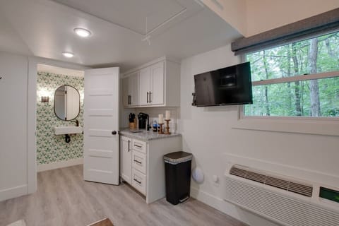 Step into the chic bathroom inside our tiny cottage. Thoughtfully designed with modern touches, sleek fixtures, and amenities for a relaxing experience surrounded by nature