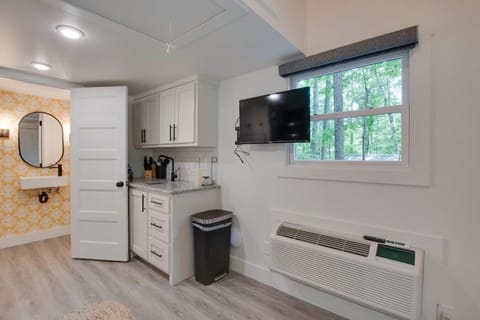 Step into the chic bathroom inside our tiny cottage. Thoughtfully designed with modern touches, sleek fixtures, and amenities for a relaxing experience surrounded by nature