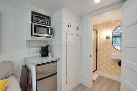 Cozy tiny cottage kitchenette stocked with essentials | prepare meals with ease, from morning coffee to dinner, perfect for couples or solo travelers seeking a relaxing nature escape