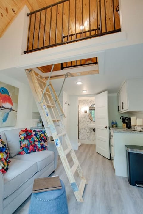 Charming tiny cottage with a cozy loft bedroom, private fire pit, and beautiful forest views. Ideal for couples or solo travelers seeking peace and relaxation