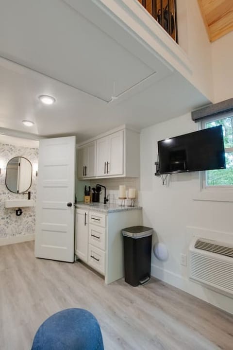Step into the chic bathroom inside our tiny cottage. Thoughtfully designed with modern touches, sleek fixtures, and amenities for a relaxing experience surrounded by nature