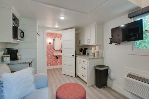 Step into the chic bathroom inside our tiny cottage. Thoughtfully designed with modern touches, sleek fixtures, and amenities for a relaxing experience surrounded by nature