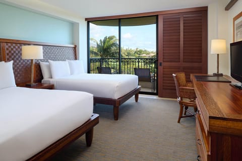 Unwind in a sunlit room with tropical views beyond the glass.