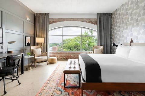 Wake up to soft light and sweeping arched-window views.