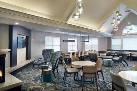 Unwind in stylish seating with warm lighting and big-screen TV.