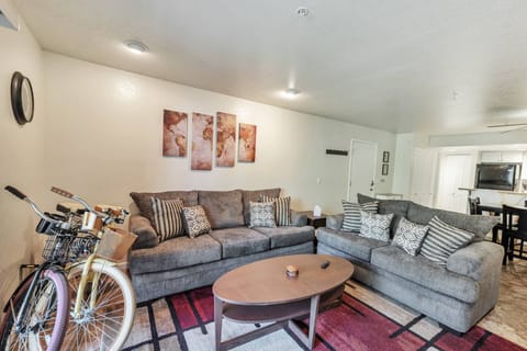 Living Room features 2 sofas, 55" Smart TV w/ YouTube TV Live & bicycles to enjoy