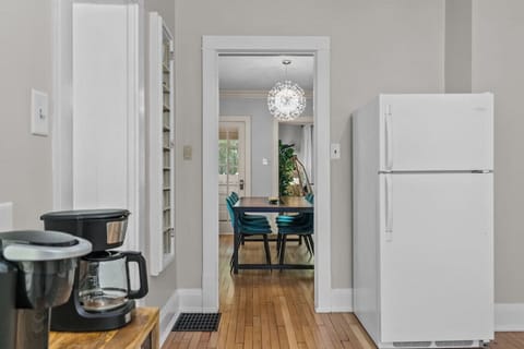 The modern and beautiful chandelier in the dining area melds with the old-world charm of the home.