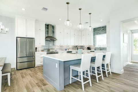 Grab a snack or watch the family chef in action at the breakfast bar seating 3