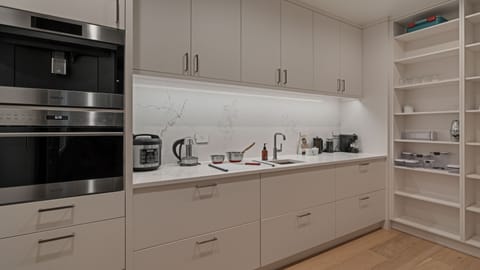 Expansive scullery behind main kitchen