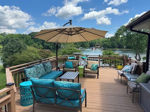 Relax on the front deck, which overlooks the yard, beach, and lake 