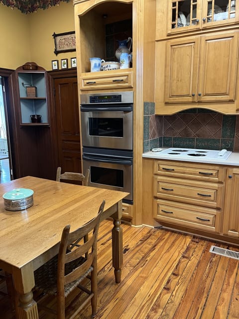 The kitchen has a double oven.  The floor is original pine wood.
