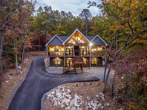 Welcome to Eagles Peak, this gorgeous, brand new construction cabin with so many amazing features! Includes double sided fireplaces, stunning mountain views, hot tubs on both front decks, indoor pool, and luxurious new home conveniences!
