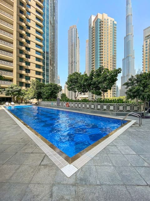 Outdoor Oasis: Dive into relaxation by the shimmering pool with stunning skyline views!