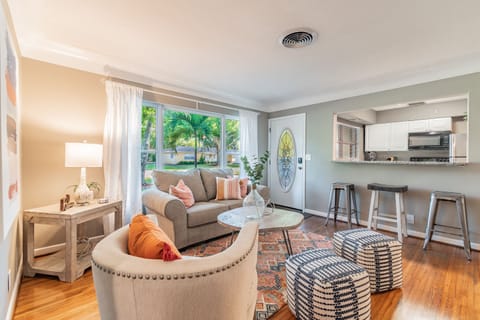The soft glow of sunlight highlights the carefully chosen décor, from the plush, comfortable seating to the tasteful accents that add subtle elegance to the room.