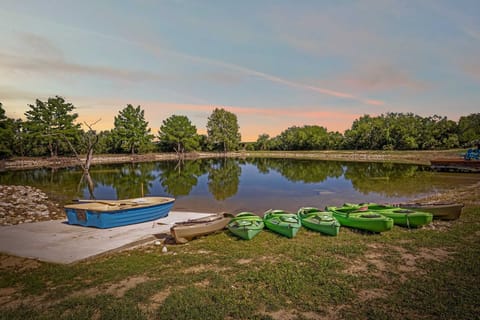 Paddle into adventure with kayaks and boats ready for fun on this peaceful private lake at sunset.