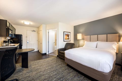 Settle into a spacious studio with kitchenette and plush bed.