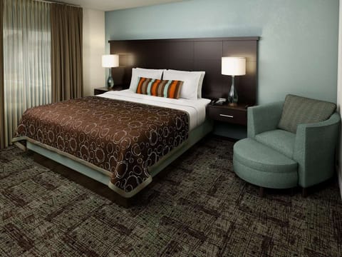 Sink into a plush king bed for deep, quiet sleep.