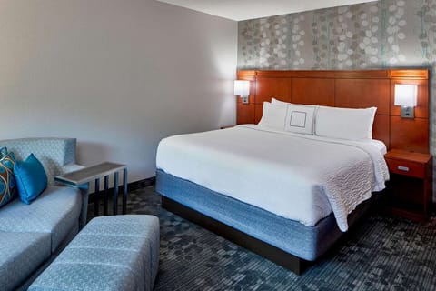 Unwind in a plush king bed after a busy day.