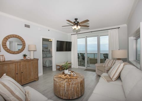 Living area with smart TV and gulf view with access to balcony
