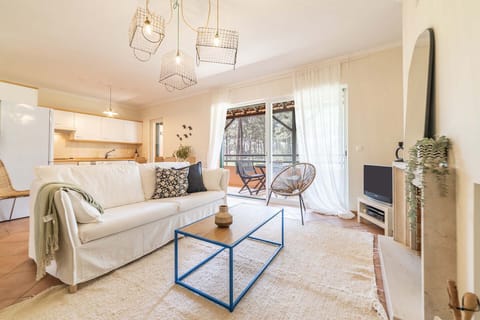 Bright open-plan living room with blue coffee table — Apartment Pedro, holiday apartment in Portugal