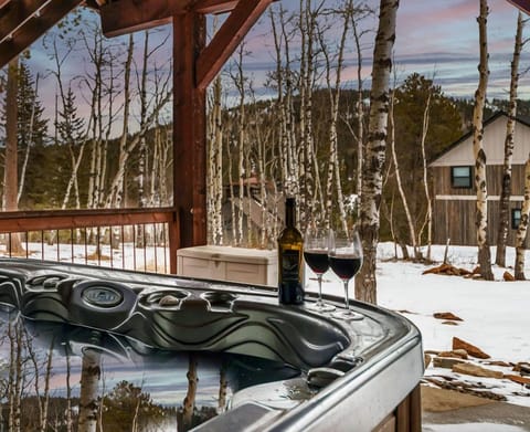 Six person hot tub off of the lower level of the cabin. 