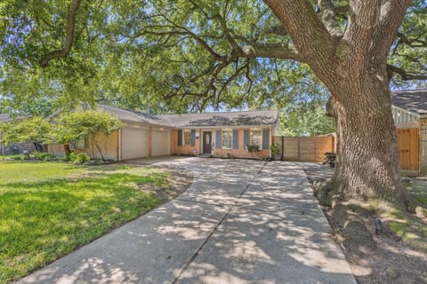 Large La shaped driveway with 150 year old Oak tree to welcome you home.